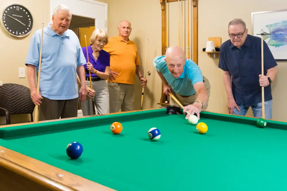 Freedom Village residents playing pool