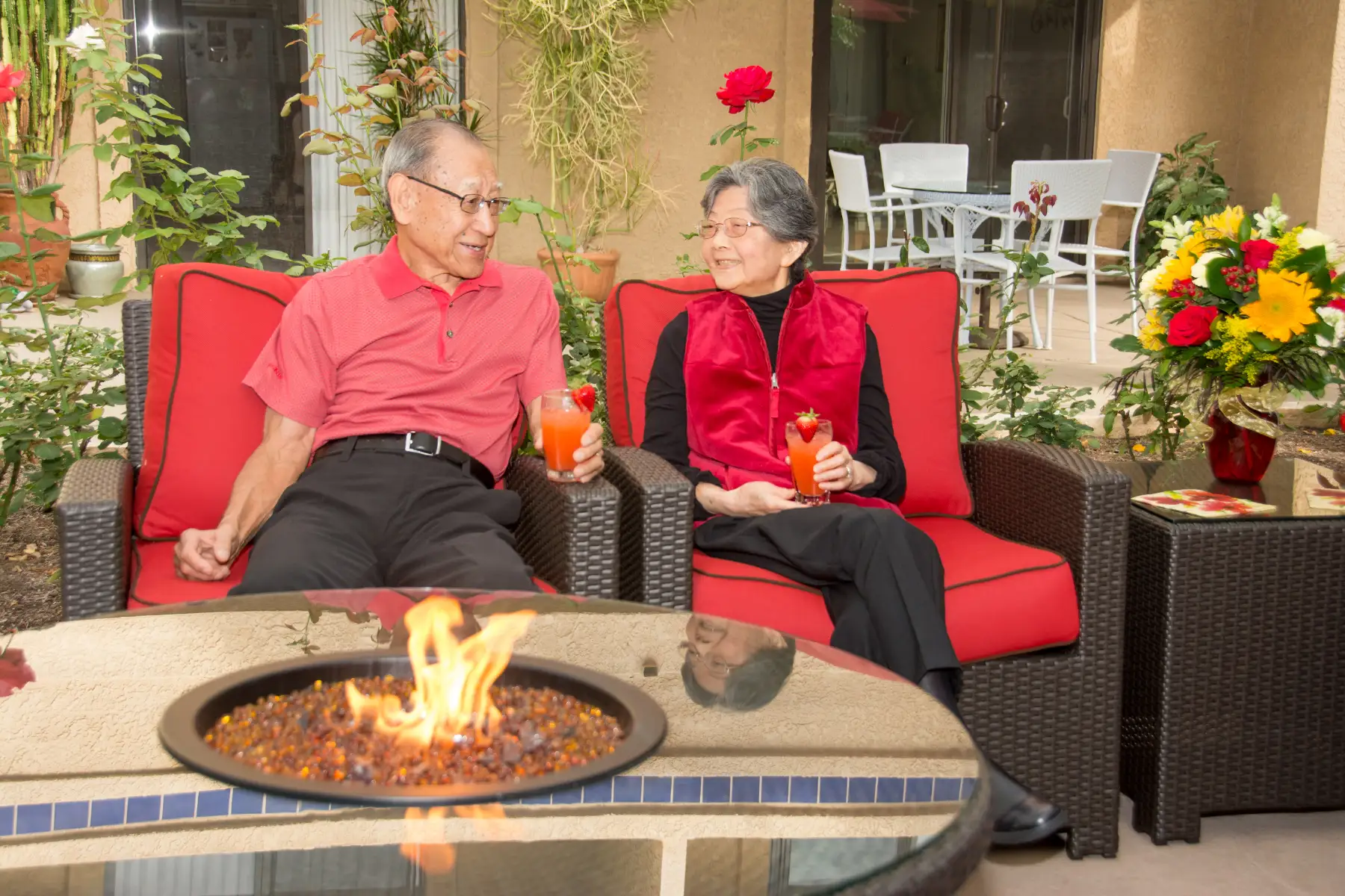 Freedom Village residents sitting outside on the patio