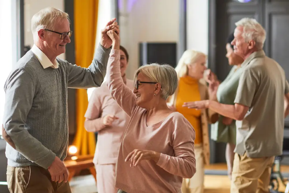 residents of a Life Plan Community dancing together