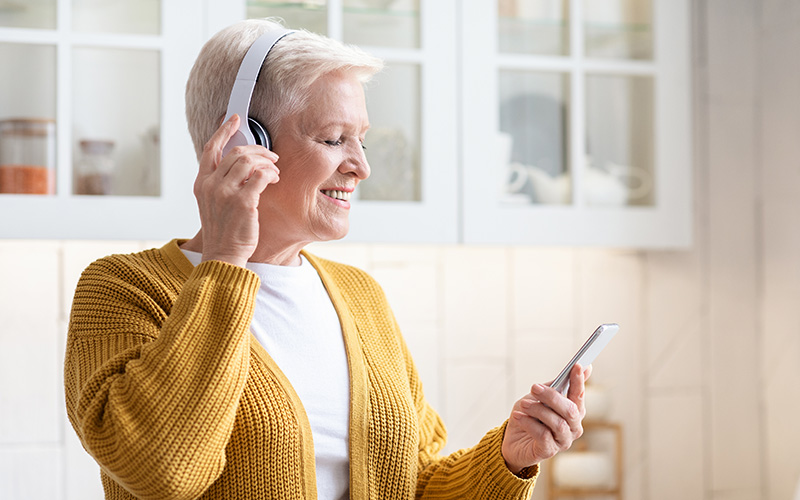 Senior listening to headphones 